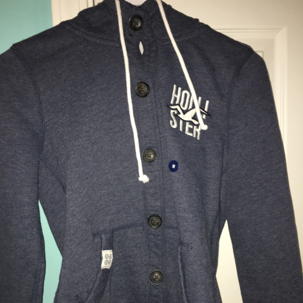 A navy blue Hollister button up jacket brand new.